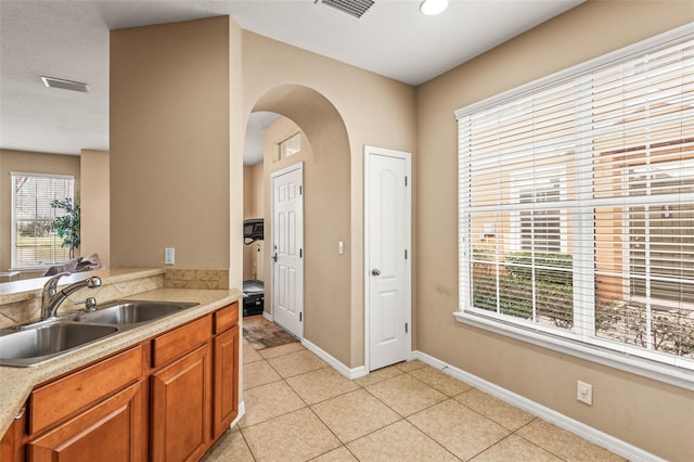 kitchen with sink and light tile patterned floors