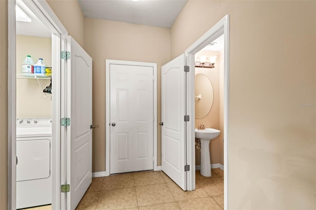 interior space featuring washer / clothes dryer and sink