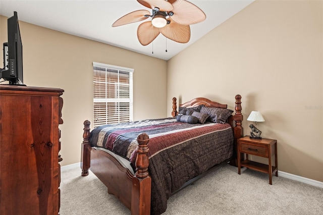 carpeted bedroom featuring ceiling fan and lofted ceiling