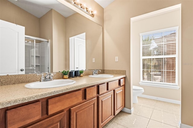 bathroom with toilet, vanity, an enclosed shower, and tile patterned floors