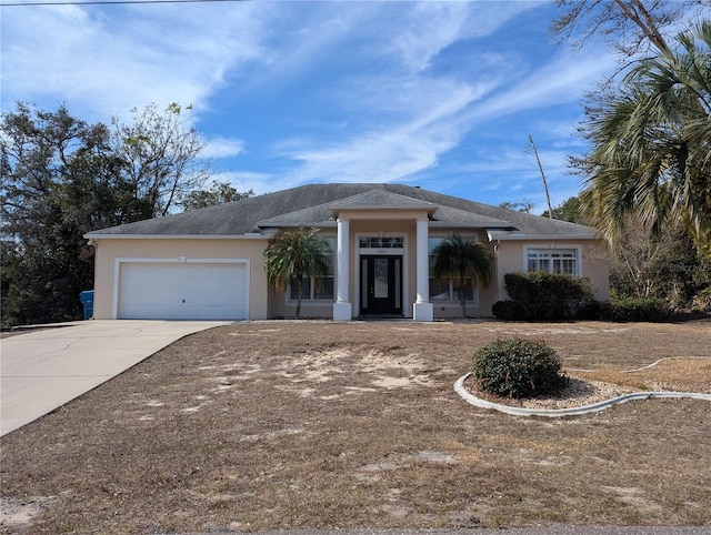 single story home with a garage