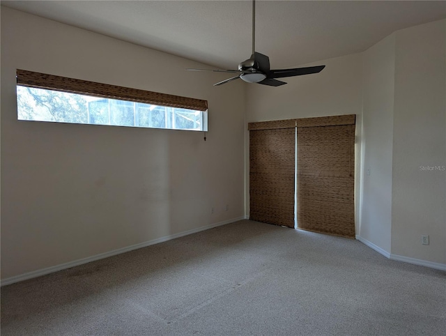 unfurnished bedroom with ceiling fan and carpet