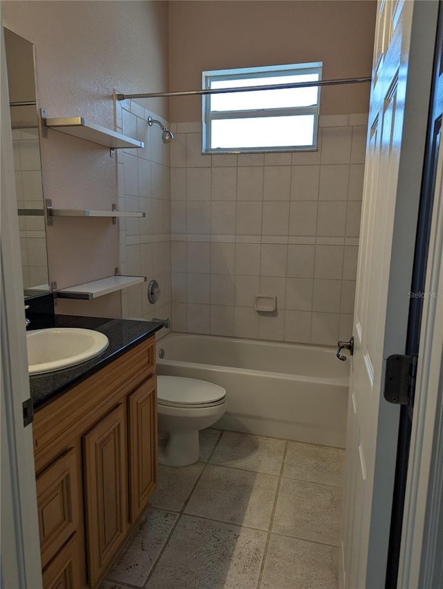 full bathroom with tiled shower / bath combo, vanity, and toilet