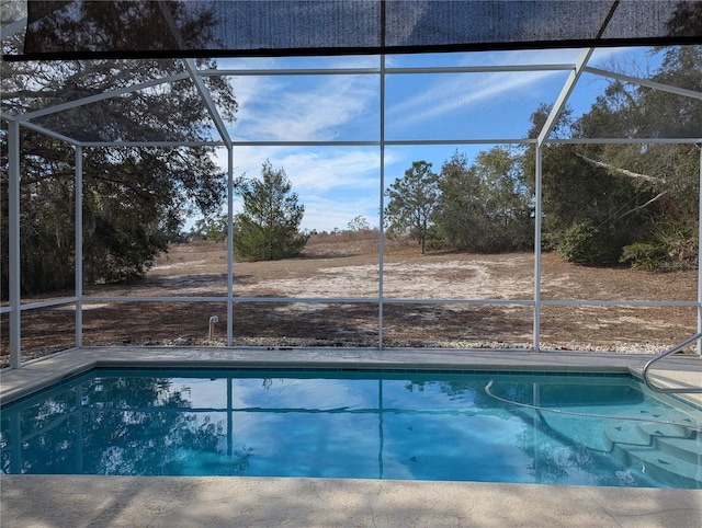 view of pool featuring a lanai