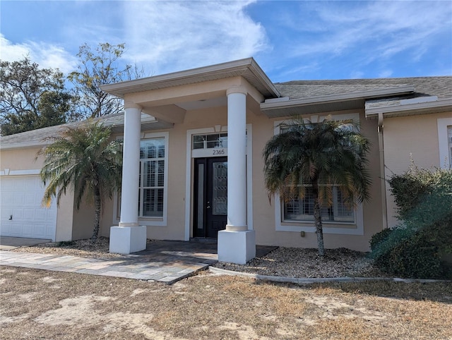 property entrance featuring a garage