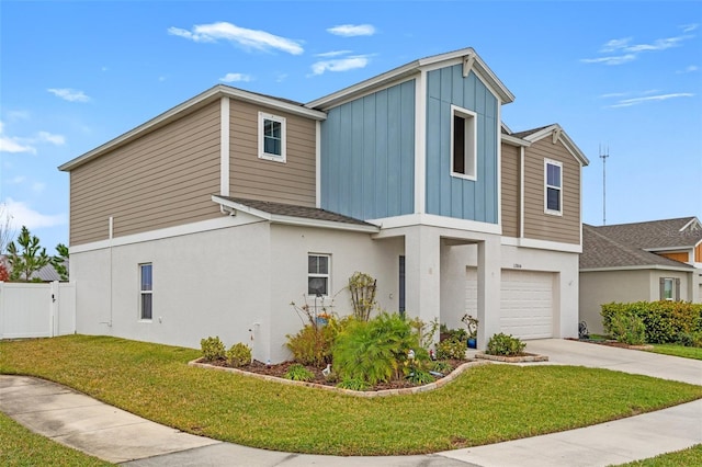 view of front facade with a front yard and a garage