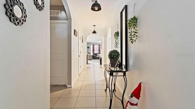 hallway with light tile patterned floors