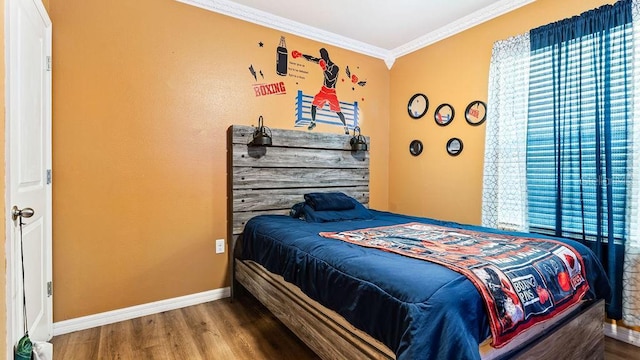 bedroom featuring hardwood / wood-style floors and crown molding