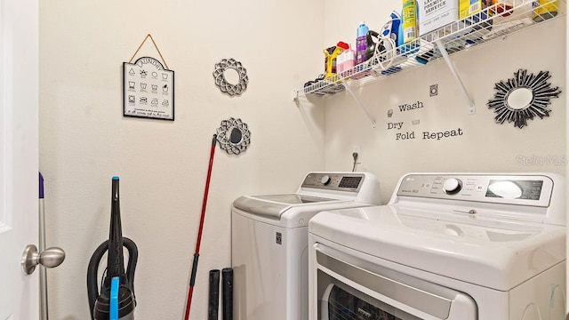 clothes washing area featuring washer and dryer