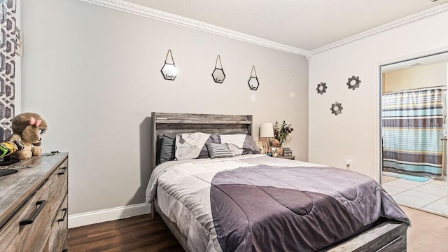 bedroom featuring dark wood-type flooring and ornamental molding