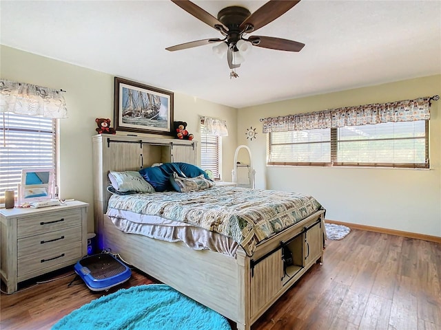 bedroom featuring ceiling fan and dark hardwood / wood-style floors