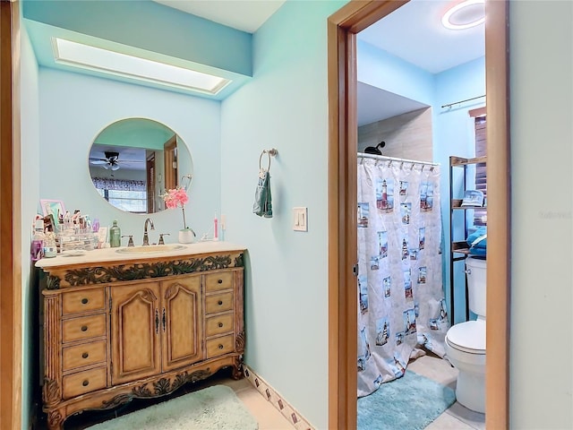 bathroom featuring ceiling fan, tile patterned flooring, walk in shower, and vanity