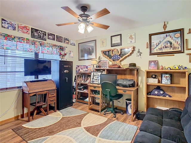 home office featuring ceiling fan and light hardwood / wood-style flooring