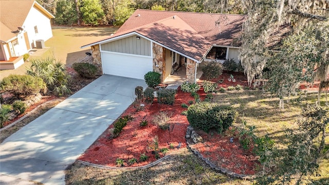 view of front of property with a garage and a front lawn