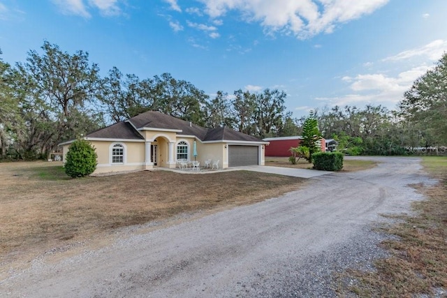 single story home featuring a garage