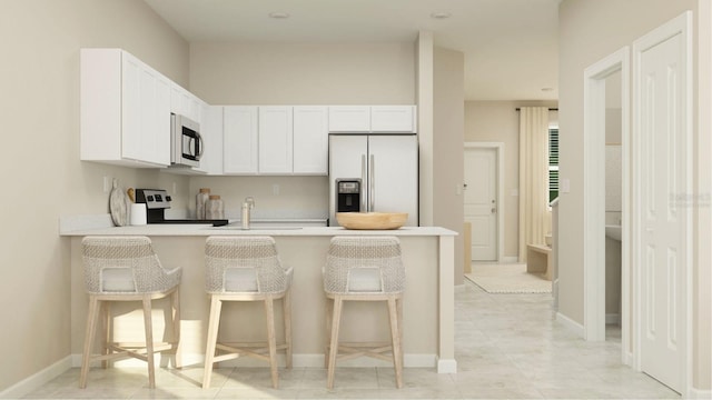 kitchen with stainless steel electric stove, white cabinets, kitchen peninsula, a breakfast bar, and white refrigerator with ice dispenser