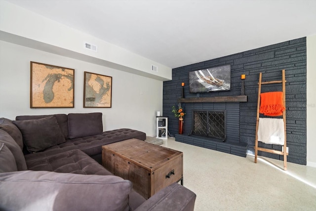 living room with carpet floors and a fireplace