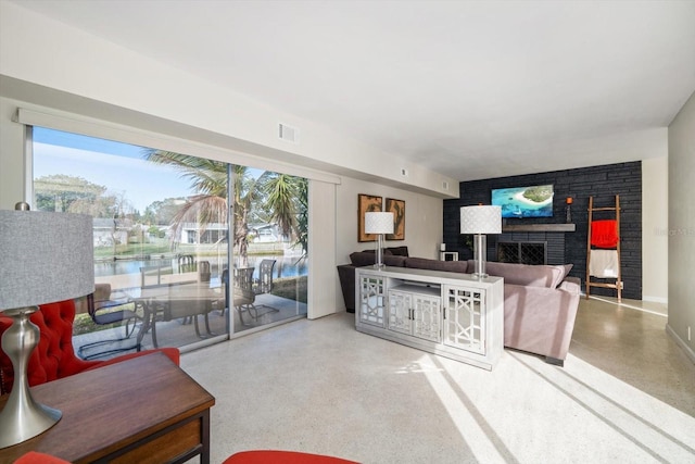 living room with plenty of natural light and a water view