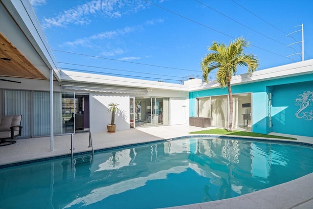 view of swimming pool with a patio area