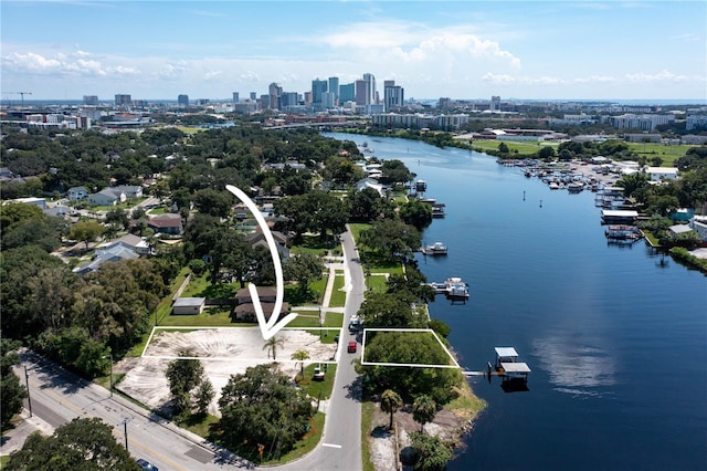 aerial view featuring a view of city and a water view