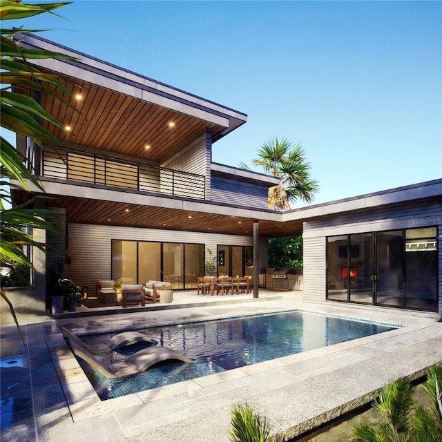 back of house with a patio, a balcony, and outdoor lounge area