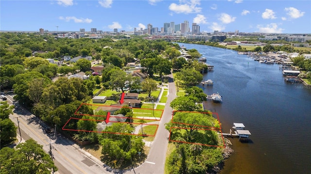 bird's eye view featuring a view of city and a water view