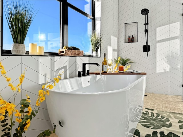 interior details featuring a freestanding bath