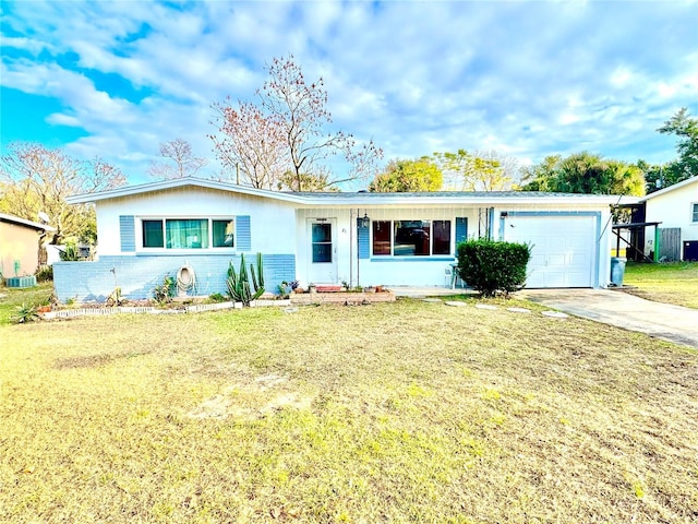 ranch-style home with a front lawn, a garage, and central AC