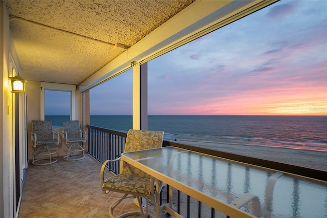 balcony at dusk with a water view