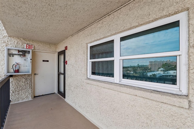 view of exterior entry featuring stucco siding