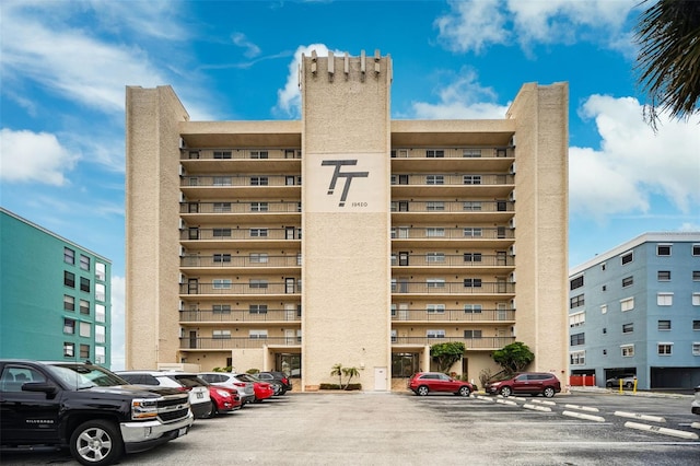 view of property with uncovered parking