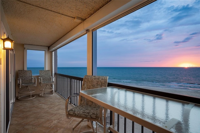 balcony at dusk with a water view