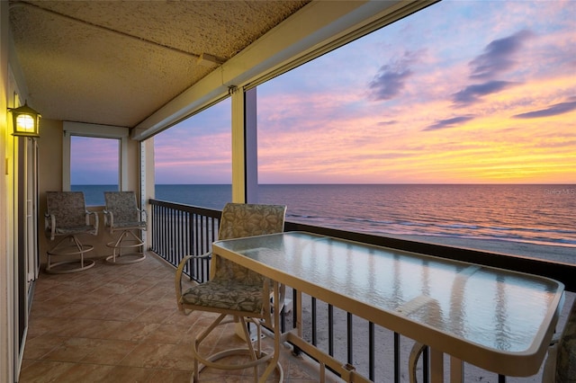 balcony at dusk with a water view