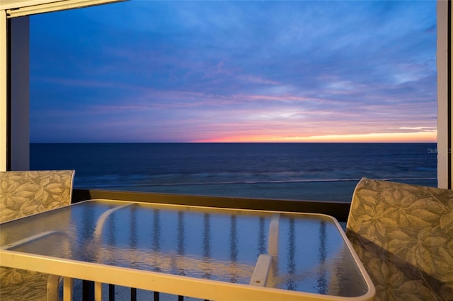 pool at dusk with a water view