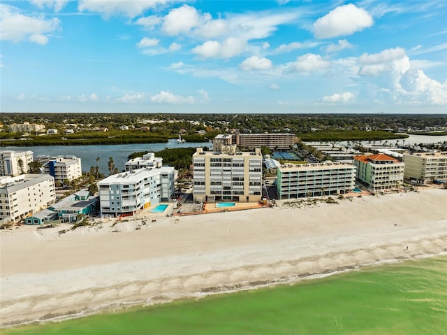 birds eye view of property with a water view and a city view