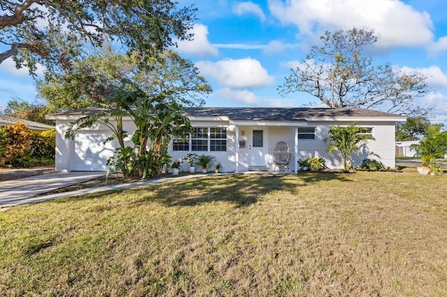 ranch-style house featuring a front lawn and a garage