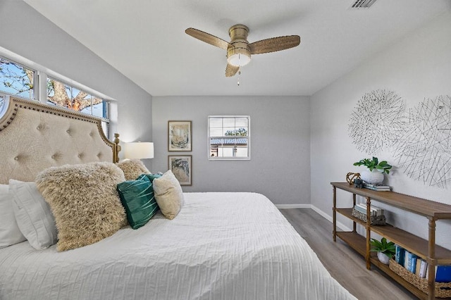 bedroom featuring ceiling fan and wood-type flooring