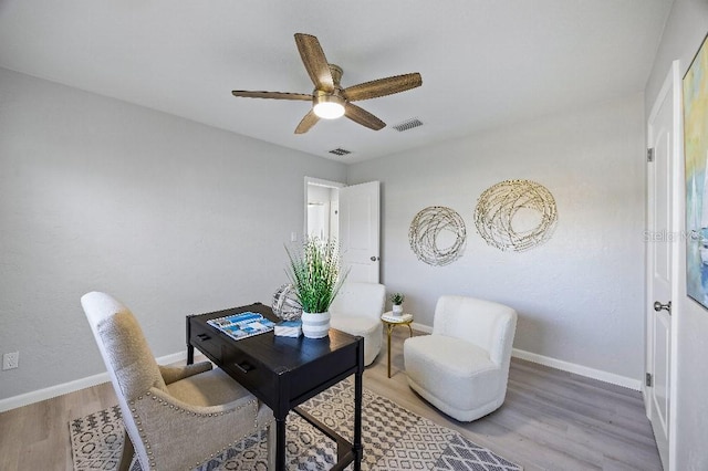 office area with ceiling fan and wood-type flooring