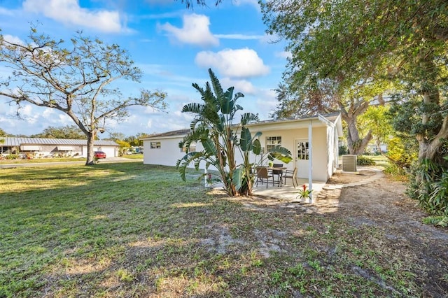 exterior space featuring central AC unit and a patio area