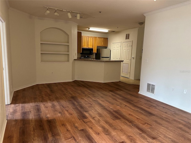 kitchen featuring stainless steel refrigerator, crown molding, built in features, and kitchen peninsula