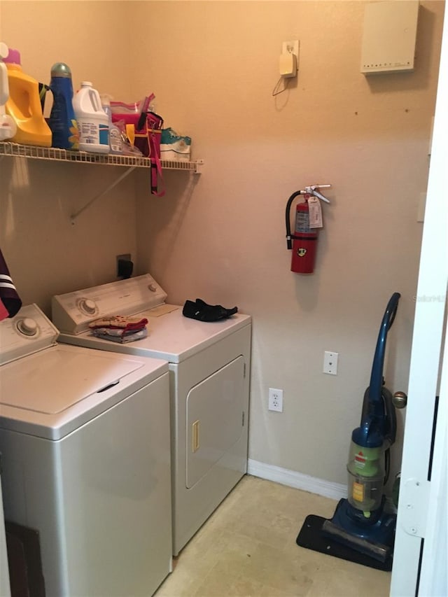 washroom featuring washer and clothes dryer