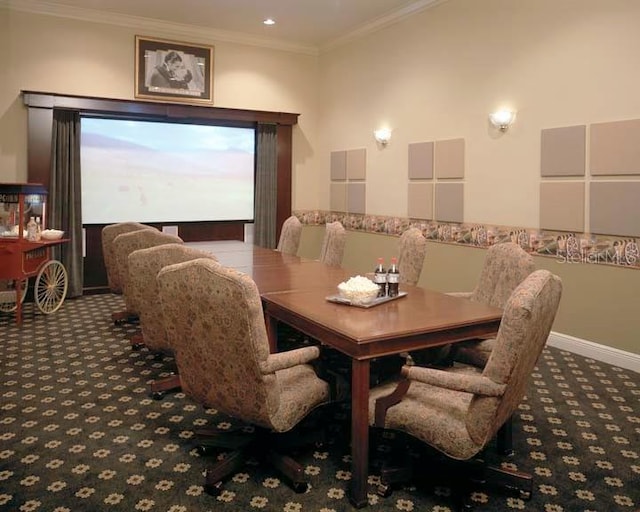 carpeted dining space with crown molding