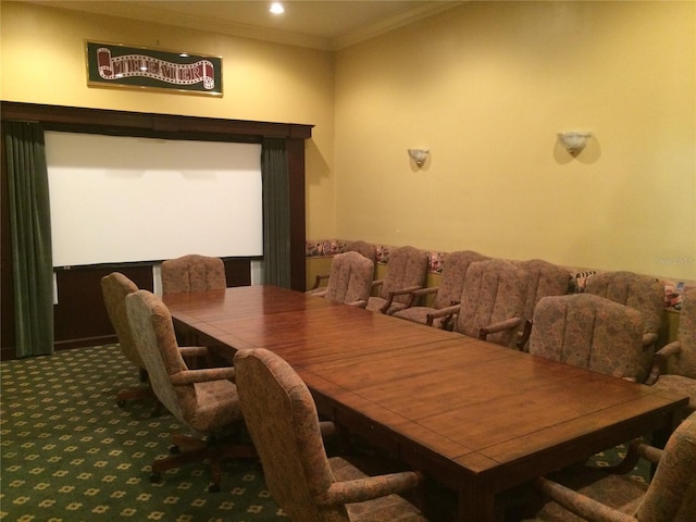 dining area with carpet flooring and crown molding