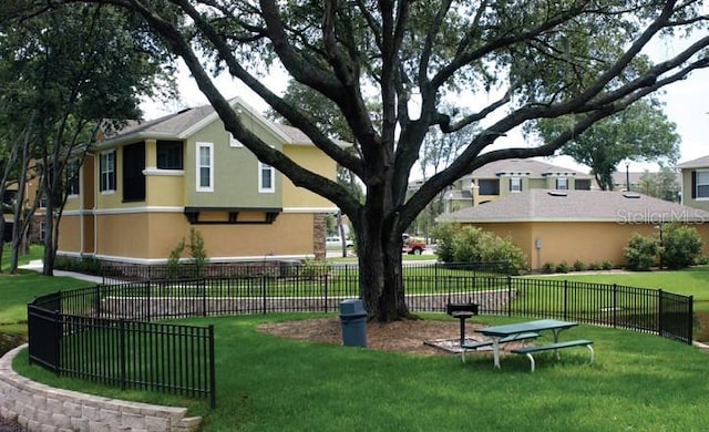 view of home's community featuring a yard