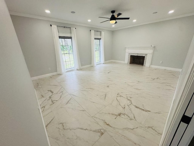 unfurnished living room with ornamental molding and ceiling fan