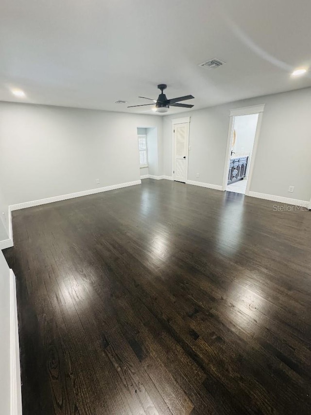 empty room featuring dark hardwood / wood-style floors and ceiling fan