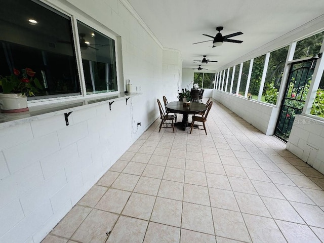 sunroom / solarium with ceiling fan