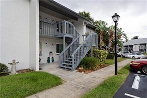 view of property featuring stairs