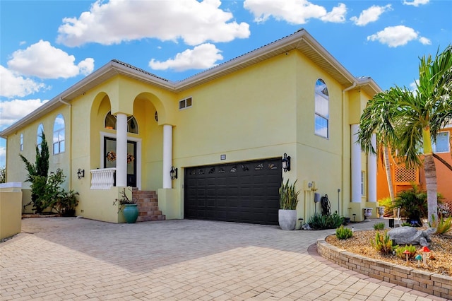 mediterranean / spanish-style house featuring a garage