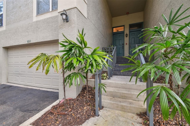 view of exterior entry featuring a garage